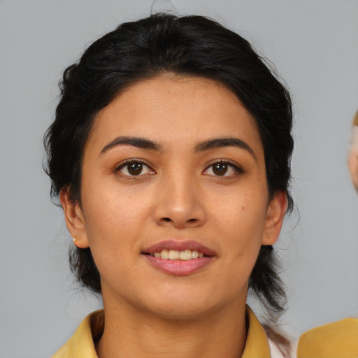 Joyful asian young-adult female with medium  brown hair and brown eyes