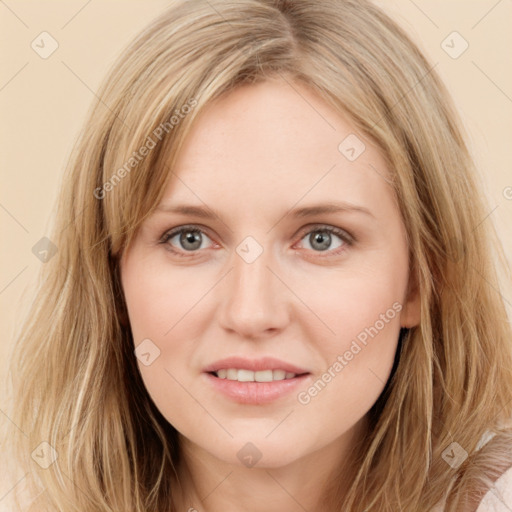 Joyful white young-adult female with long  brown hair and blue eyes