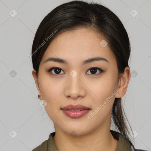 Joyful latino young-adult female with medium  brown hair and brown eyes