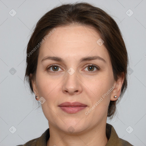 Joyful white adult female with medium  brown hair and brown eyes