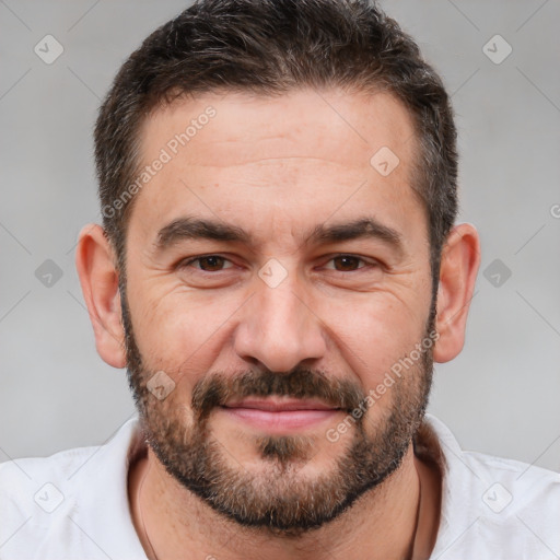 Joyful white adult male with short  brown hair and brown eyes