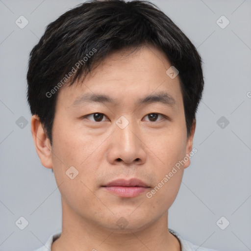 Neutral asian young-adult male with short  brown hair and brown eyes