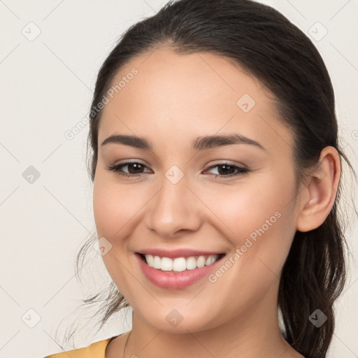 Joyful white young-adult female with long  brown hair and brown eyes