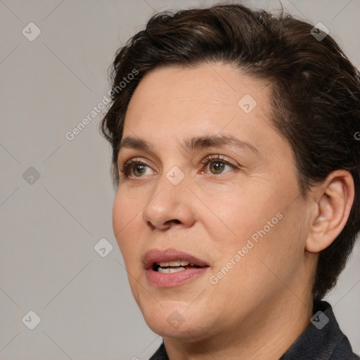 Joyful white adult female with medium  brown hair and brown eyes