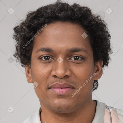 Joyful black young-adult male with short  brown hair and brown eyes
