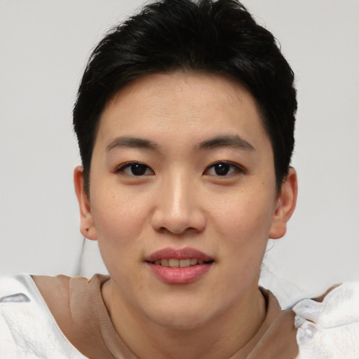 Joyful asian young-adult female with short  black hair and brown eyes