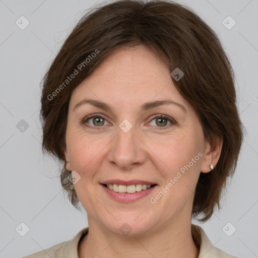 Joyful white adult female with medium  brown hair and grey eyes