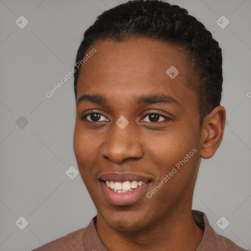 Joyful black young-adult male with short  black hair and brown eyes