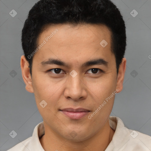 Joyful latino young-adult male with short  brown hair and brown eyes