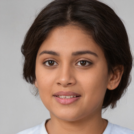 Joyful white young-adult female with medium  brown hair and brown eyes