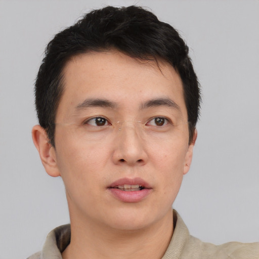 Neutral asian young-adult male with short  brown hair and brown eyes