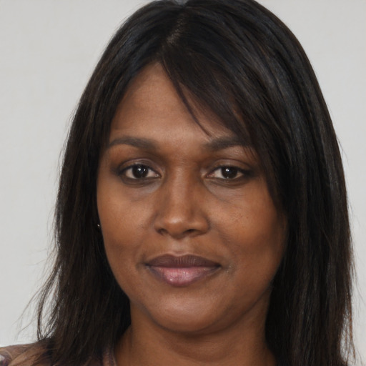 Joyful asian young-adult female with long  brown hair and brown eyes