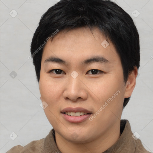 Joyful asian young-adult male with short  brown hair and brown eyes