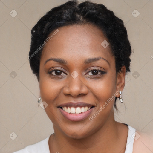 Joyful black young-adult female with short  black hair and brown eyes