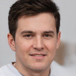 Joyful white adult male with short  brown hair and brown eyes