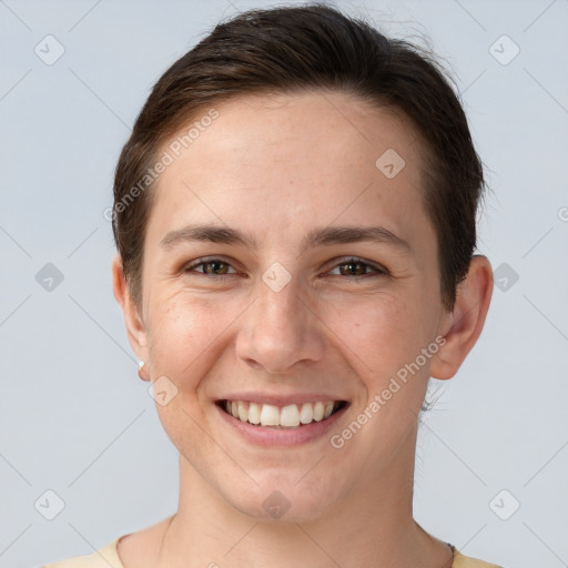 Joyful white young-adult female with short  brown hair and brown eyes