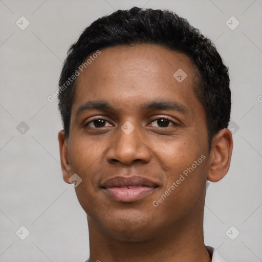 Joyful black young-adult male with short  black hair and brown eyes