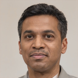 Neutral latino adult male with short  black hair and brown eyes