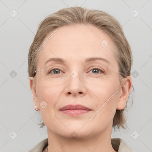 Joyful white adult female with medium  brown hair and grey eyes