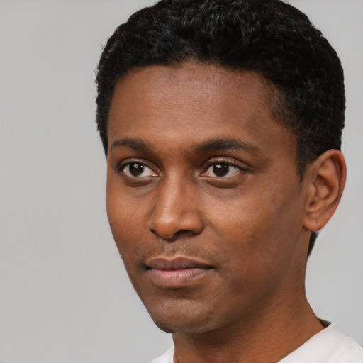 Neutral black young-adult male with short  black hair and brown eyes
