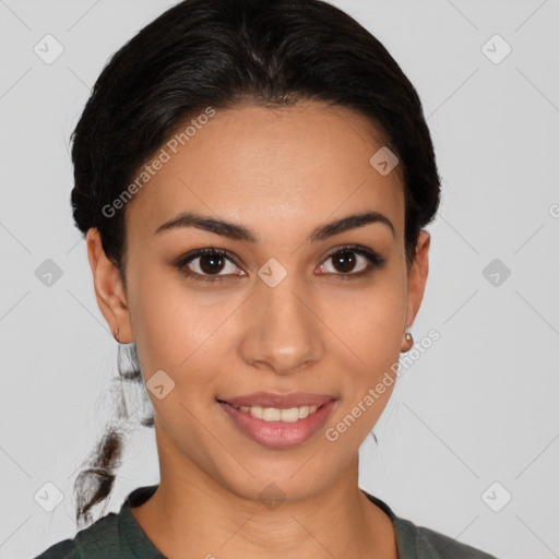 Joyful latino young-adult female with short  brown hair and brown eyes