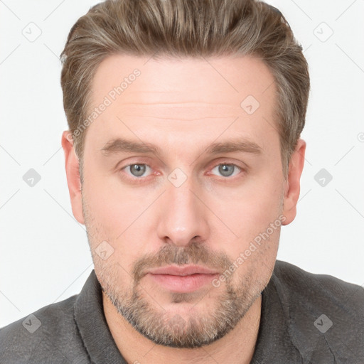 Neutral white adult male with short  brown hair and grey eyes