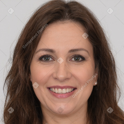 Joyful white adult female with long  brown hair and brown eyes