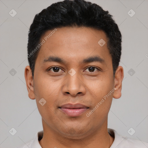 Joyful latino young-adult male with short  black hair and brown eyes