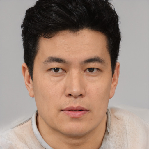 Neutral asian young-adult male with short  brown hair and brown eyes