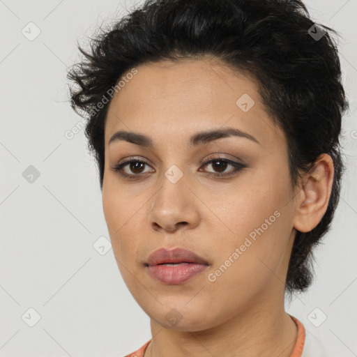 Joyful latino young-adult female with short  brown hair and brown eyes