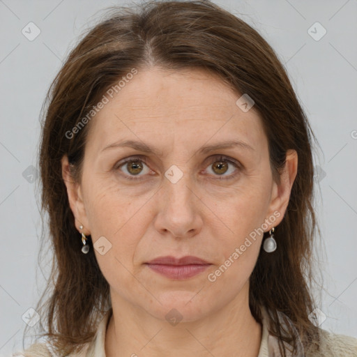 Joyful white adult female with medium  brown hair and grey eyes