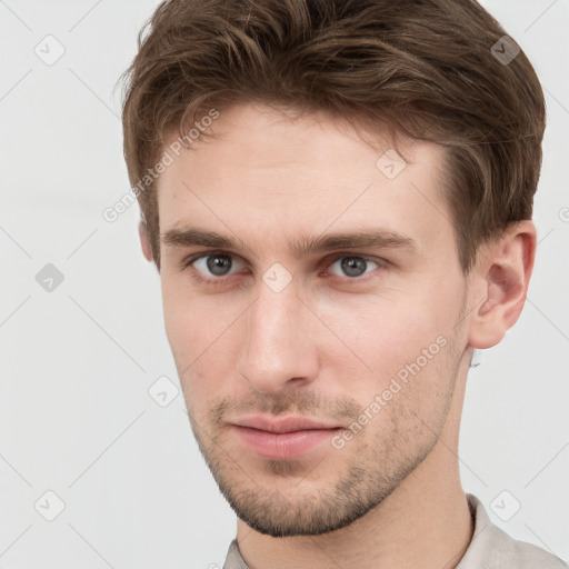 Neutral white young-adult male with short  brown hair and grey eyes