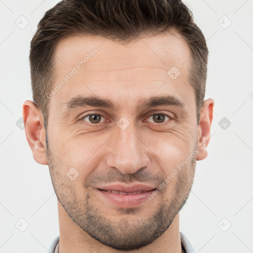 Joyful white adult male with short  brown hair and brown eyes