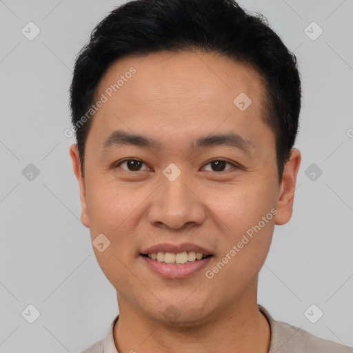 Joyful asian young-adult male with short  brown hair and brown eyes