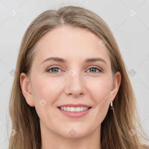 Joyful white young-adult female with long  brown hair and grey eyes