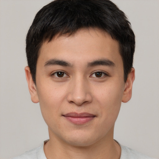 Joyful asian young-adult male with short  brown hair and brown eyes