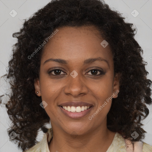 Joyful black young-adult female with medium  brown hair and brown eyes