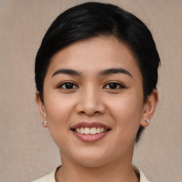 Joyful asian young-adult female with short  black hair and brown eyes