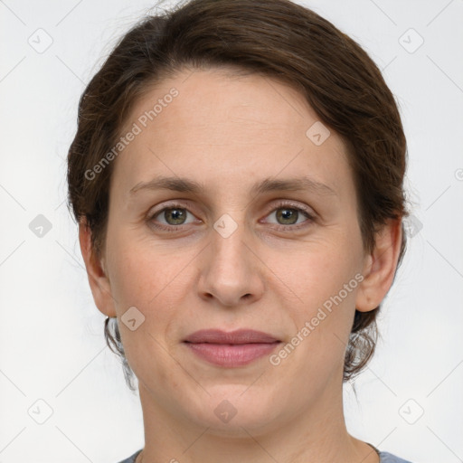 Joyful white adult female with short  brown hair and grey eyes