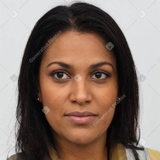 Joyful black young-adult female with long  brown hair and brown eyes