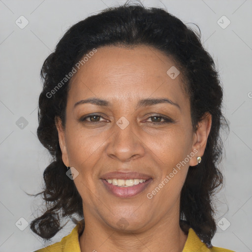 Joyful latino adult female with medium  brown hair and brown eyes