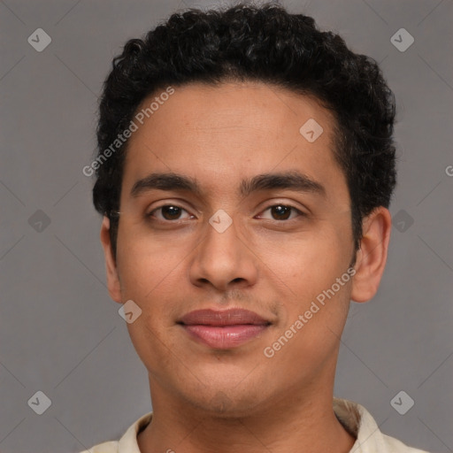 Joyful latino young-adult male with short  brown hair and brown eyes