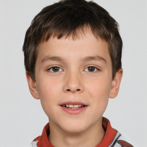 Joyful white child male with short  brown hair and brown eyes