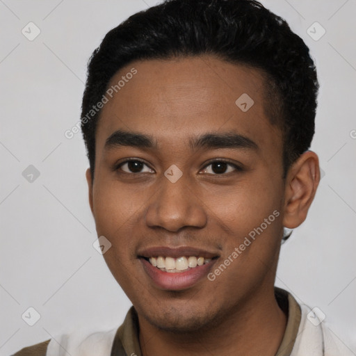 Joyful latino young-adult male with short  black hair and brown eyes