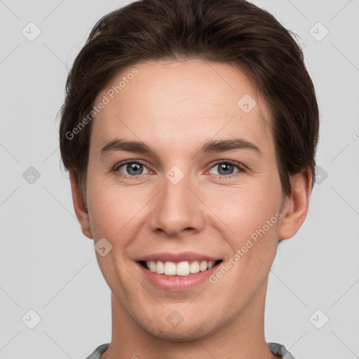 Joyful white young-adult female with short  brown hair and grey eyes