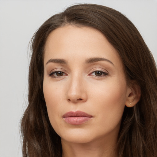 Neutral white young-adult female with long  brown hair and brown eyes