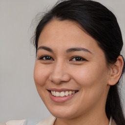 Joyful white young-adult female with medium  brown hair and brown eyes