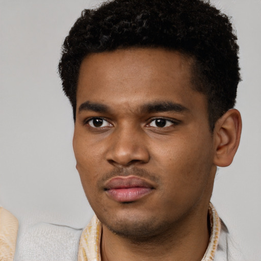 Neutral black young-adult male with short  black hair and brown eyes
