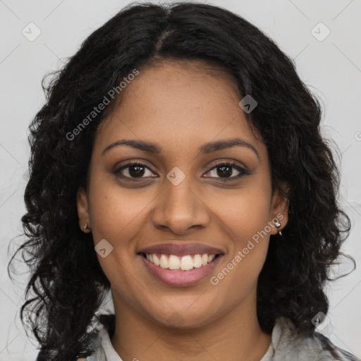 Joyful black young-adult female with long  brown hair and brown eyes