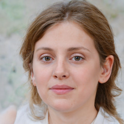 Joyful white young-adult female with medium  brown hair and blue eyes